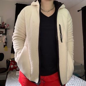 Cream colored Fila faux fur jacket.